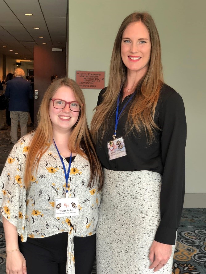 One Graduate Student posing with advisor