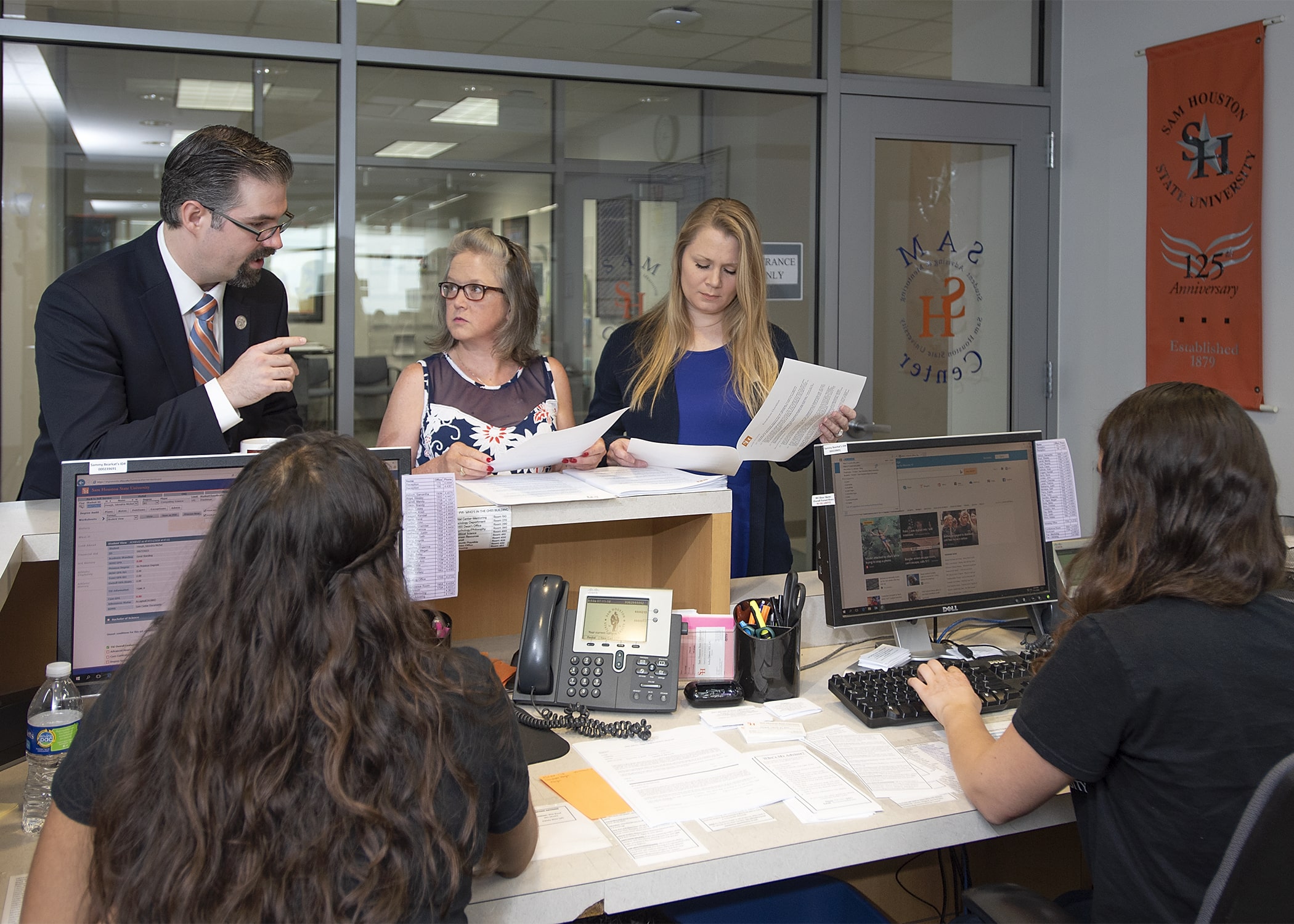 Getting work done at the front desk.