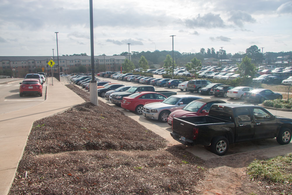 residential parking lot full of vehicles