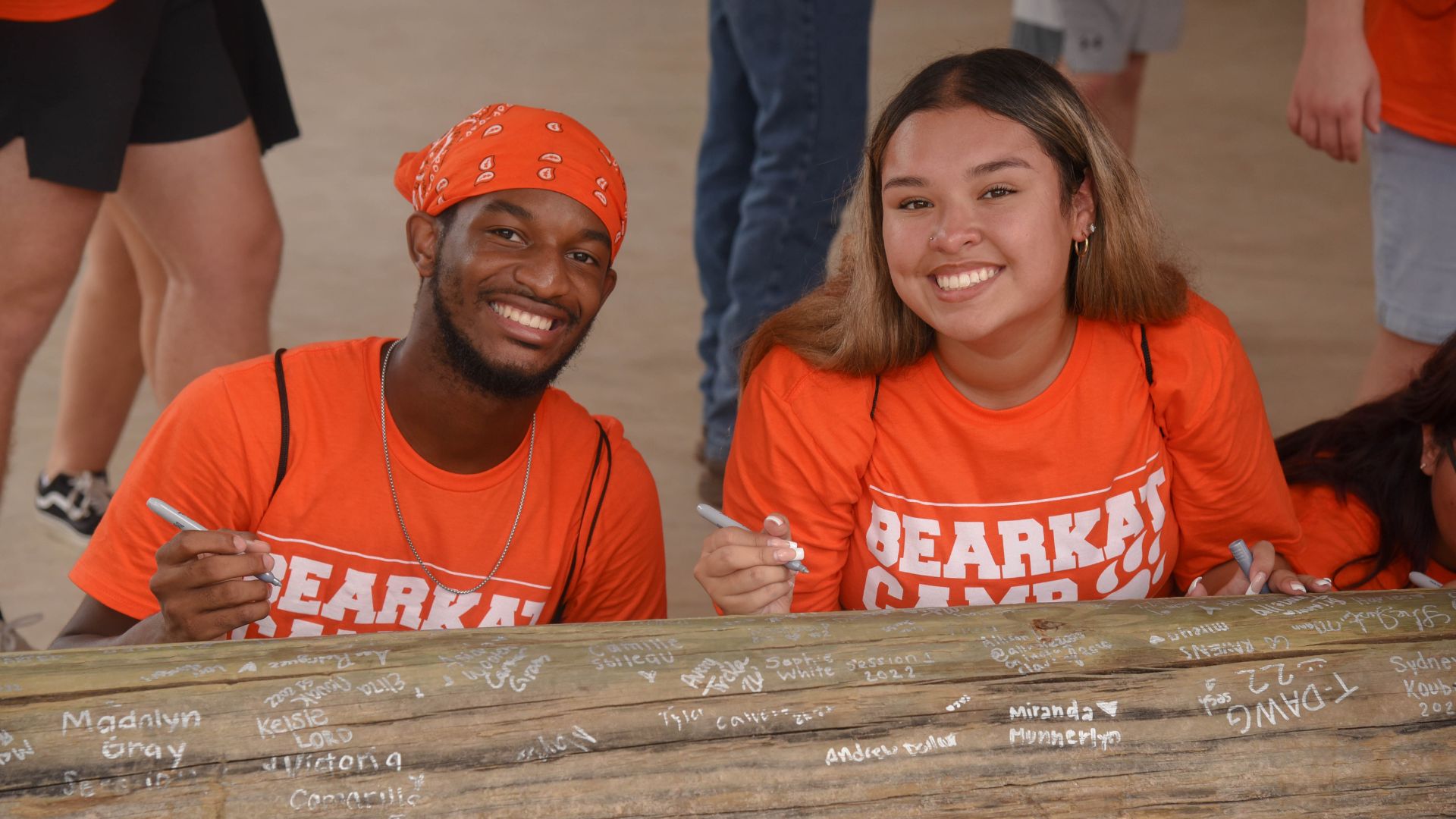 Two students smiling