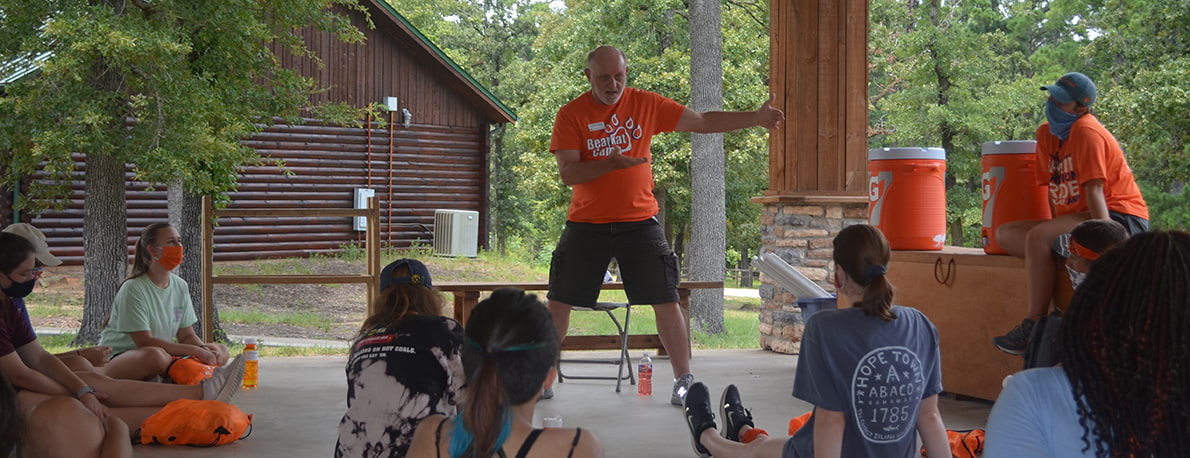 professor talks to campers