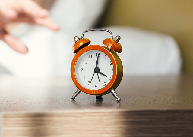 An alarm clock on a table.