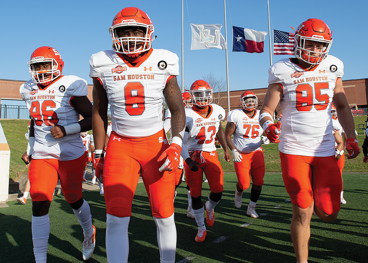 Quentin Brown dons his football uniform and takes the field.